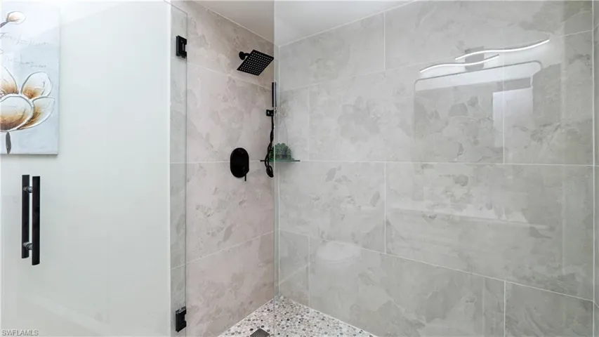Full bathroom with a stall shower
