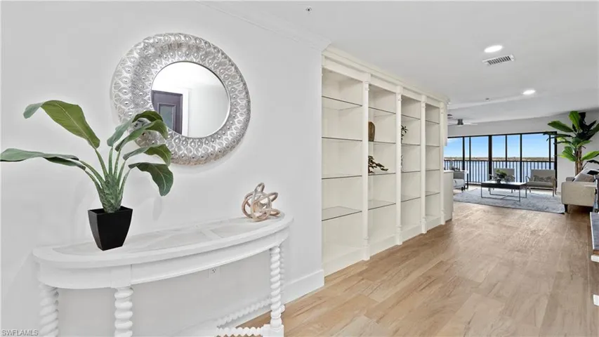 Hallway featuring light wood finished floors and recessed lighting