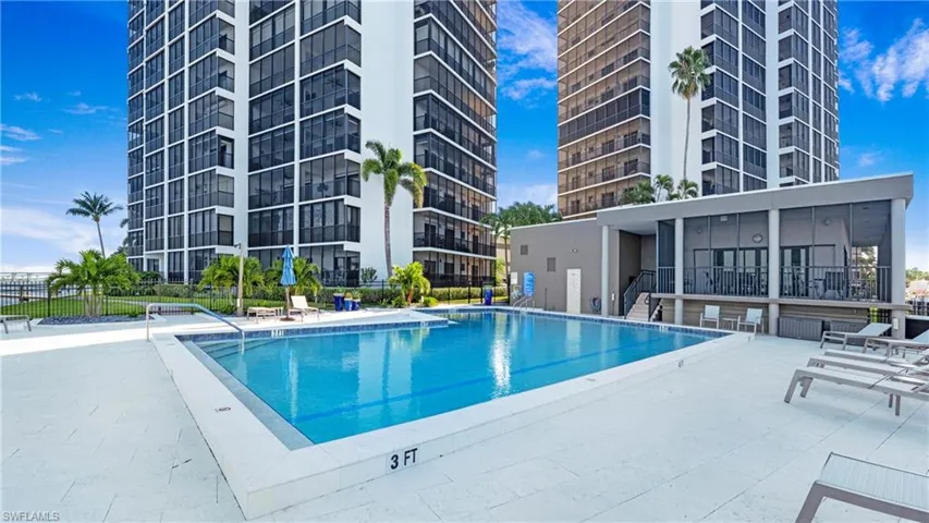 Community pool featuring a patio