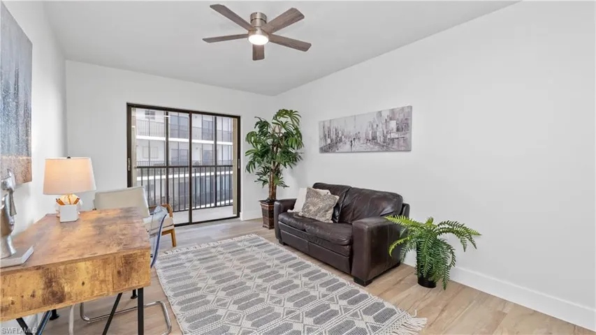 Office area with ceiling fan and light wood-type flooring