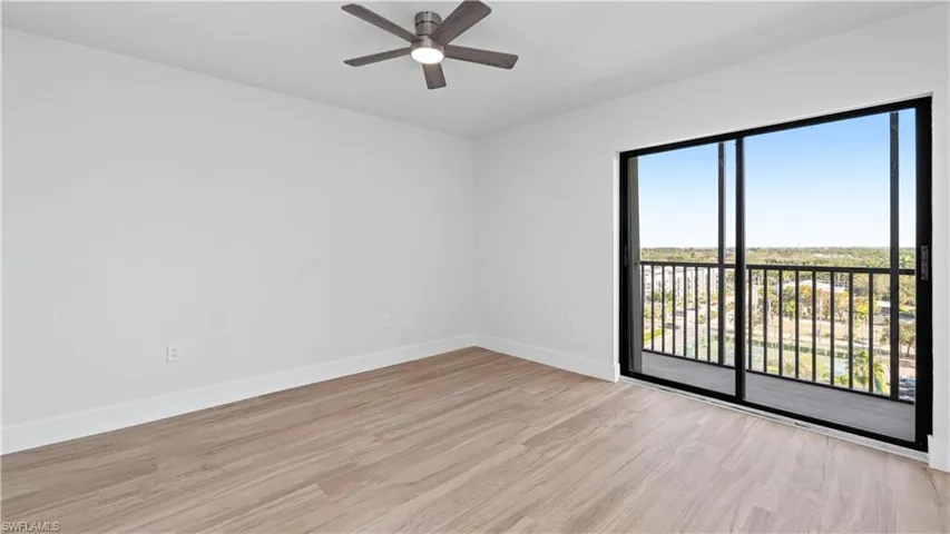 Spare room featuring light wood-style flooring and a ceiling fan