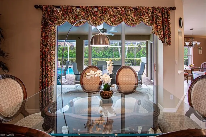 Dining area with a ceiling fan and plenty of natural light