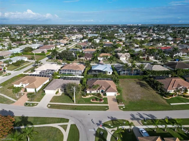 Aerial view of property's location featuring nearby suburban area