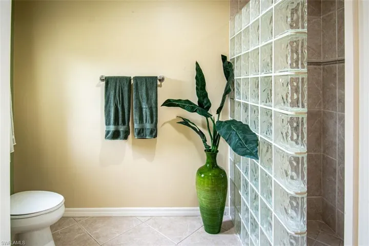 Bathroom featuring tile patterned floors and walk in shower