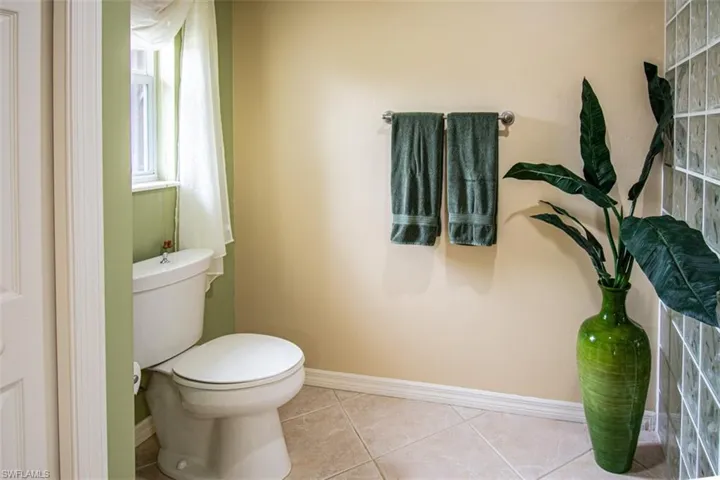 Bathroom featuring baseboards and tile patterned floors