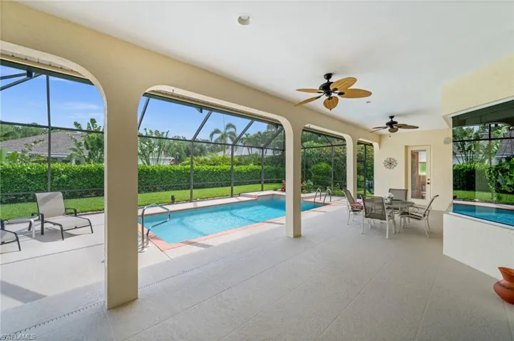 Your private outdoor oasis features a resurfaced pool with decorative water feature, updated lanai flooring, and a spacious screened enclosure—perfect for relaxing, entertaining, and enjoying the Florida lifestyle year-round.