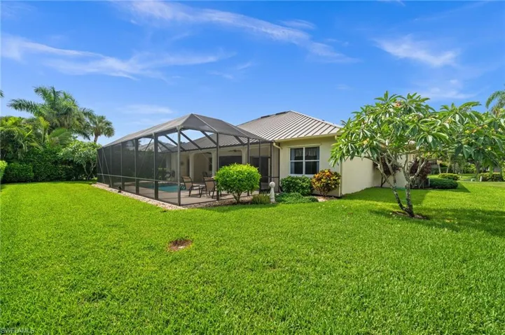 The expansive backyard provides exceptional privacy and plenty of green space.