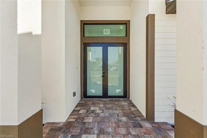 Doorway to property featuring french doors