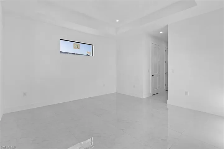 Spare room with a tray ceiling