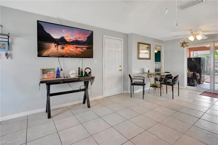 Tiled dining space with ceiling fan