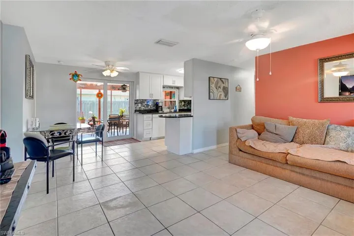 Tiled living room with ceiling fan