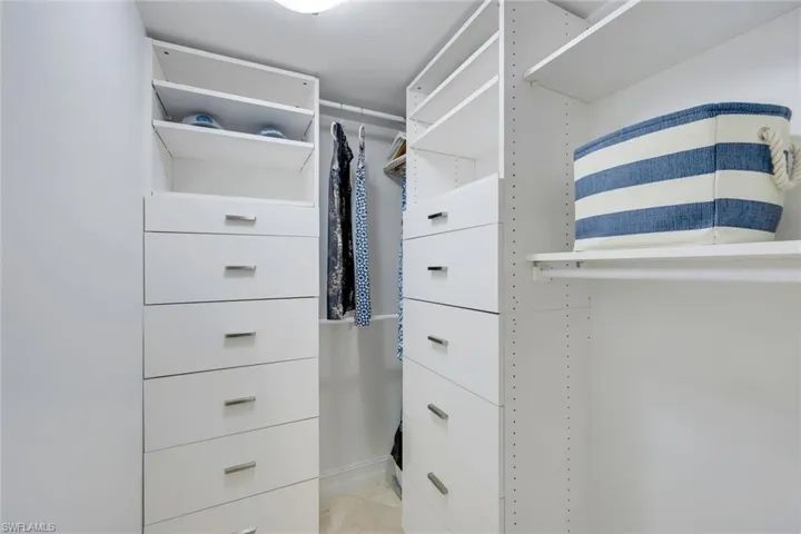 Walk-In Closet w/ Custom Built-Ins in Guest Suite