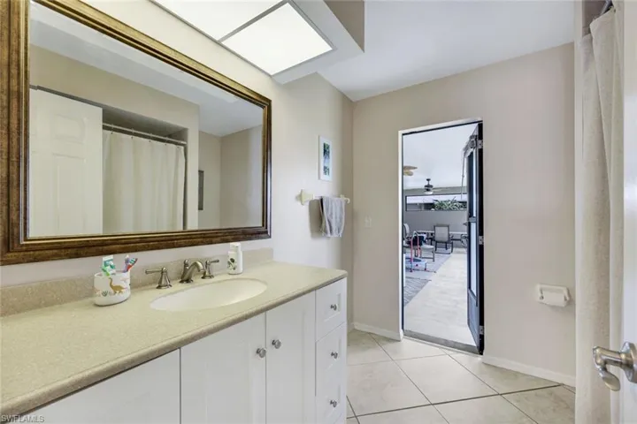 Bathroom with vanity and tile patterned flooring