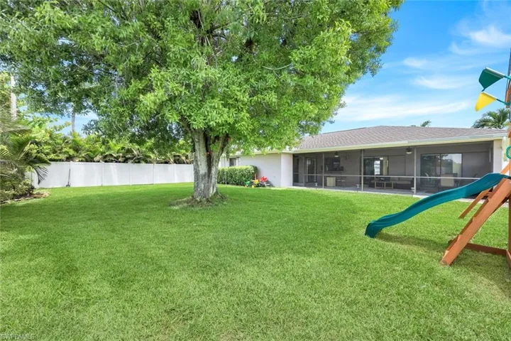 View of yard with a sunroom