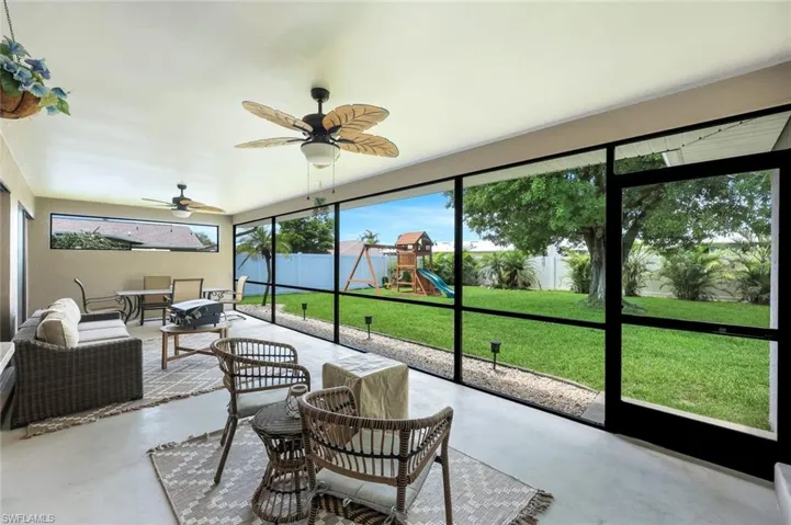 Sunroom / solarium with plenty of natural light, ceiling fan, and an outdoor hangout area