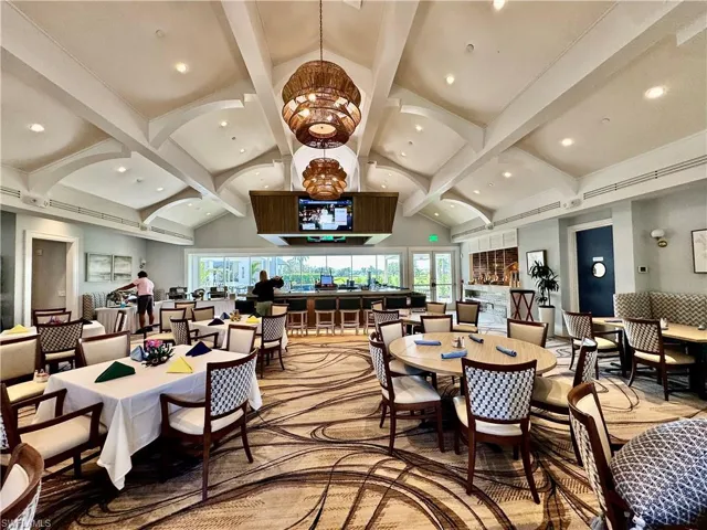 Dining space featuring beamed ceiling, recessed lighting, and high vaulted ceiling