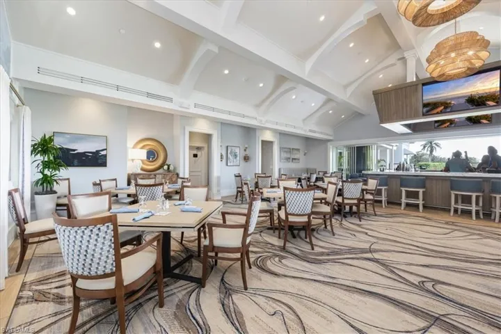 Dining space featuring high vaulted ceiling, beamed ceiling, and recessed lighting
