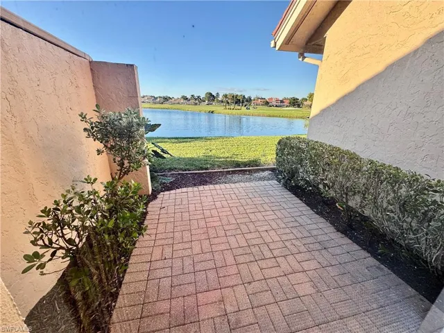 View of patio with a water view