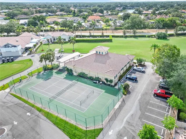 Aerial perspective of suburban area featuring a golf course