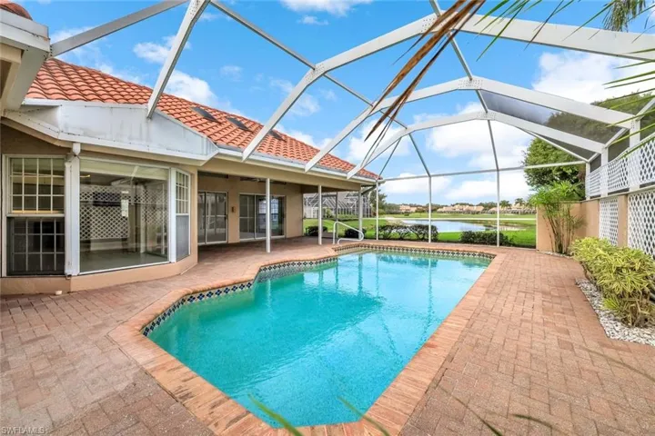 Outdoor pool with a lanai, a sunroom, and a patio