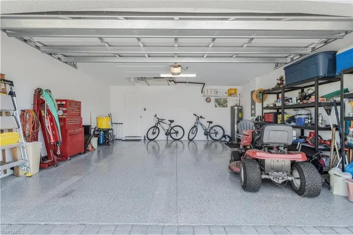 Garage with a garage door opener and electric water heater