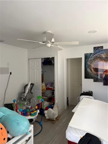 Bedroom with a closet and a ceiling fan