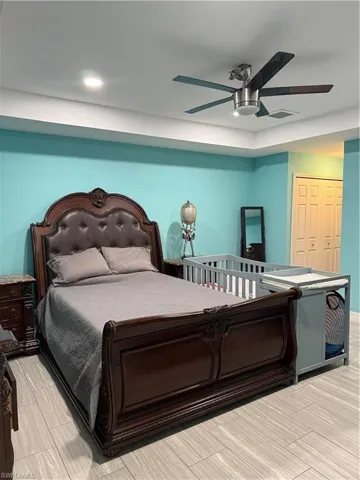 Bedroom with a closet and a ceiling fan