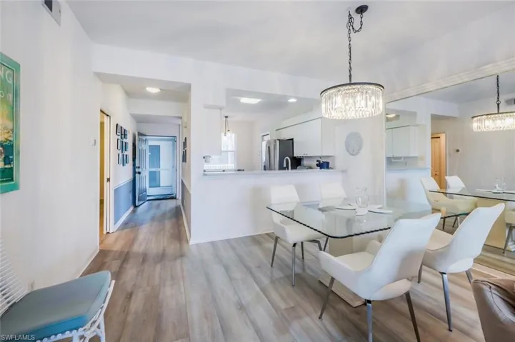 Dining space featuring light wood-style floors and baseboards