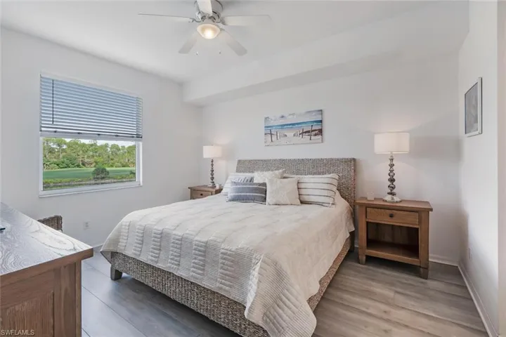 Bedroom with wood finished floors and ceiling fan