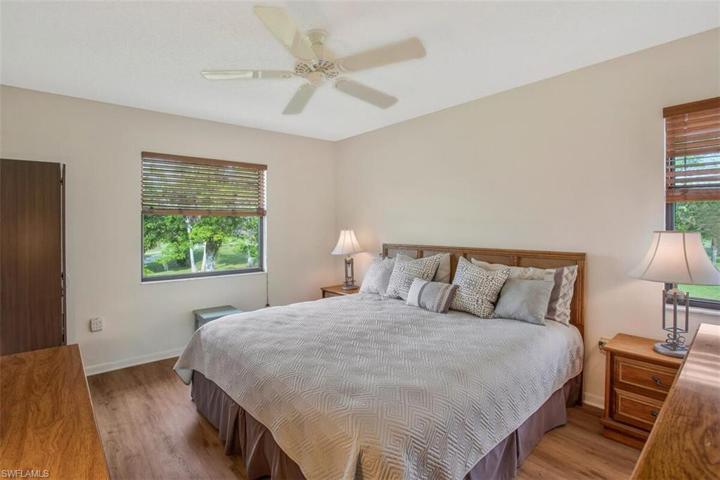 Primary bedroom with king size bed, easy care floors