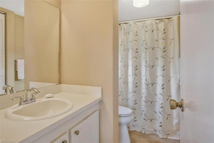 en-suite main bathroom with a walk in shower