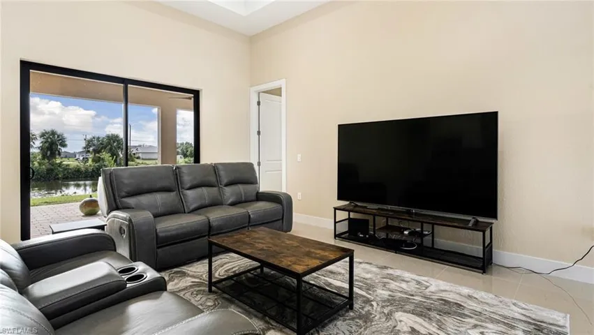 Tiled living room with baseboards