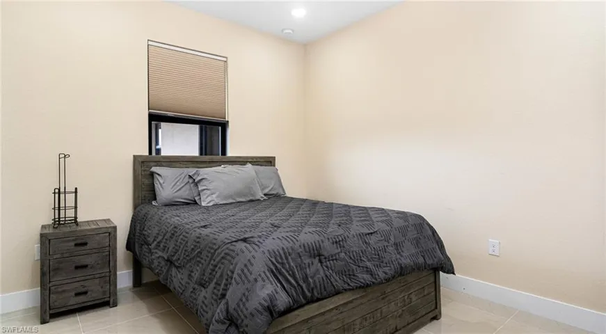 Bedroom featuring baseboards