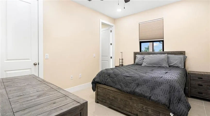 Bedroom featuring recessed lighting, baseboards, ceiling fan, and light tile patterned floors