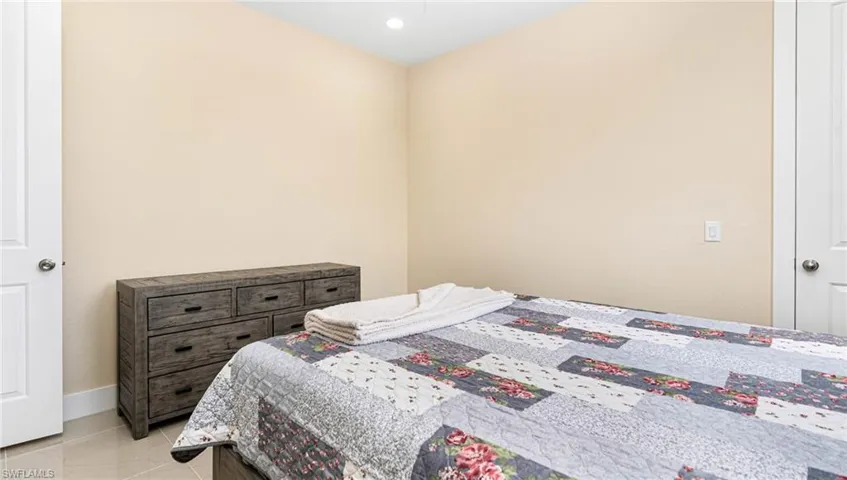 Bedroom featuring baseboards