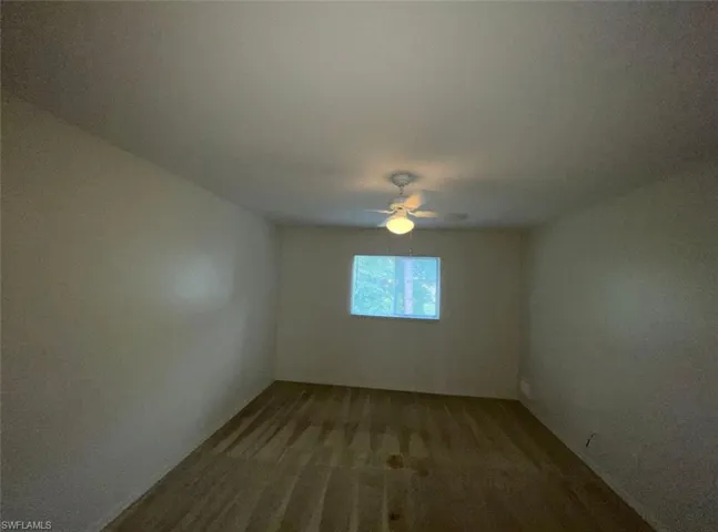 Empty room featuring ceiling fan