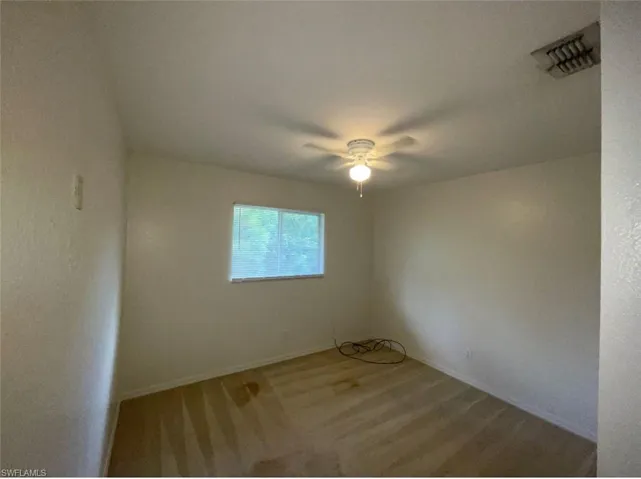 Unfurnished room with ceiling fan