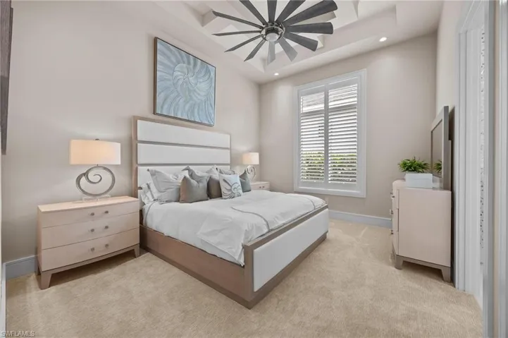 Bedroom with light carpet and ceiling fan
