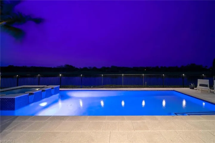 View of pool at dusk