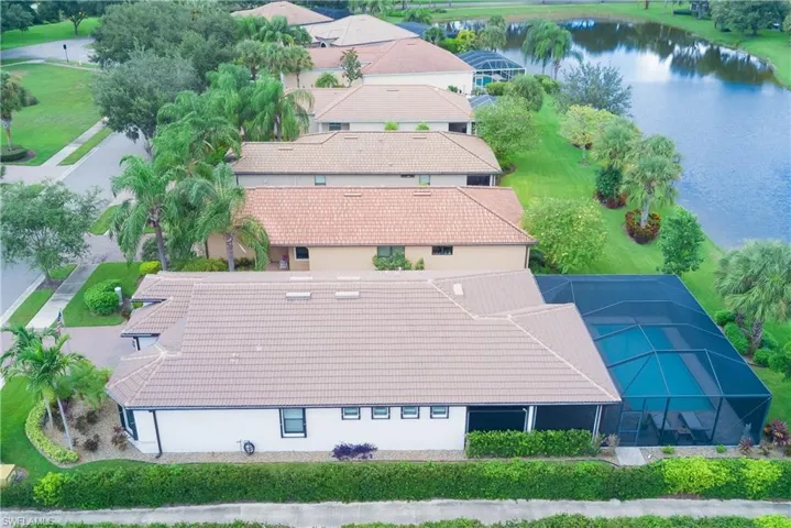 Aerial view of new landscaping on the sides of the house as well with rocks for easy maintenance