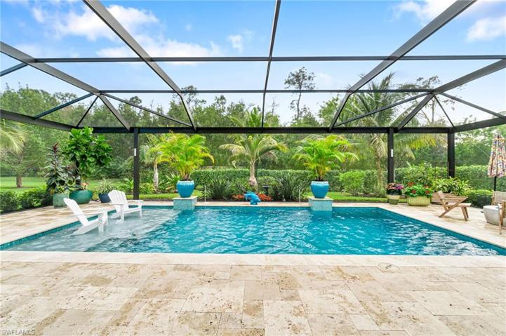 The panoramic lanai screen allows you to take in the breathtaking, professionally designed landscaping, while the oversized lanai offers many options for seating.