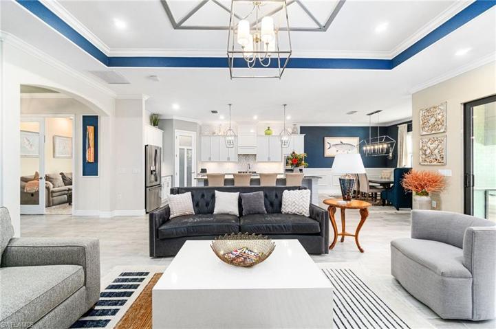 Comfort and style accented by tray ceilings offering a spacious and airy feel.  The glass double doors to the left lead into the den.
