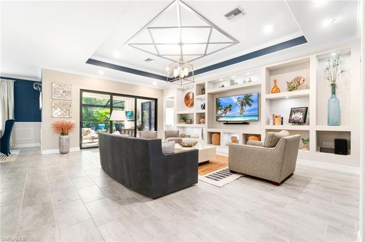 The living area looks out to the oversized, panoramic screened in lanai.