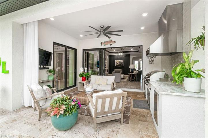 Bring the indoors out!  This outdoor kitchen allows you to do a lot of your cooking poolside!