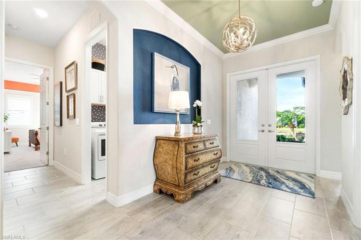 The grand entryway with 3/4 inch glass panel front doors.  The laundry, with utility tub is off of the entry.