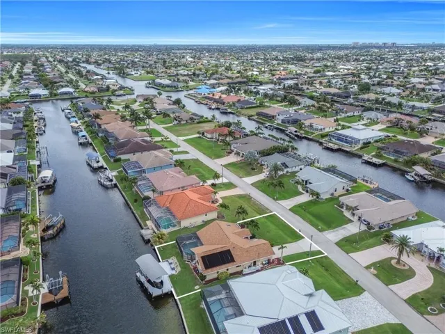 Aerial perspective of suburban area with a large body of water