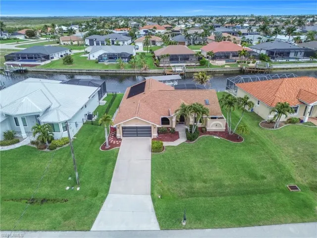 Aerial perspective of suburban area with a nearby body of water