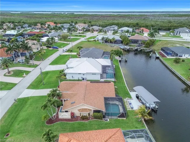 Aerial perspective of suburban area with a large body of water