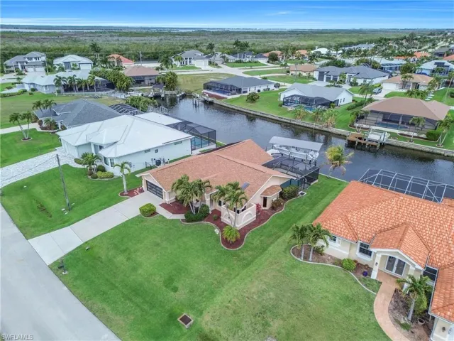 Aerial view of residential area with a nearby body of water