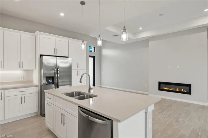 Flooring upgraded to premium, color-matched Luxury Vinyl Plank [LVP].